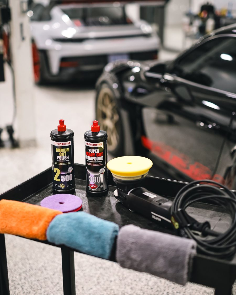 Detailing products and microfiber towels on a cart